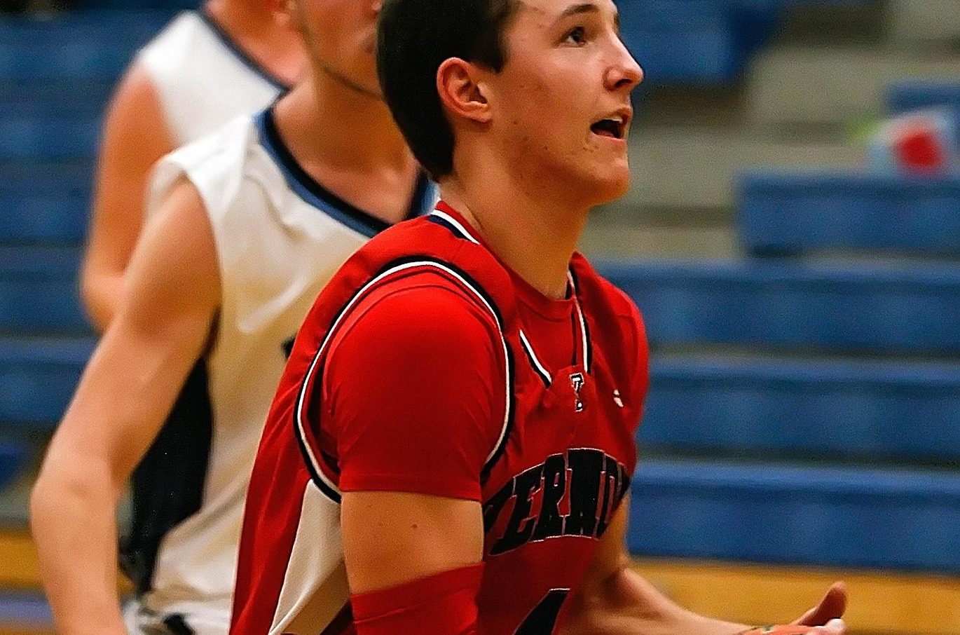 Player driving to the basketball hoop.